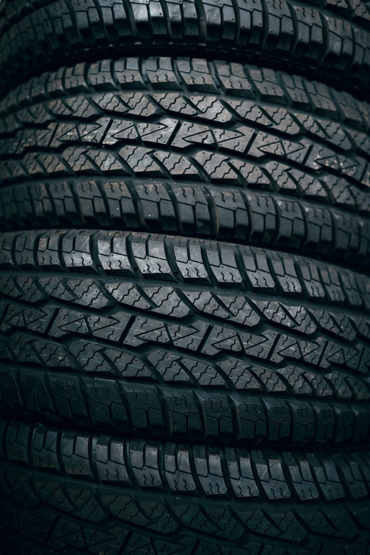 Close-up of stacked heavy-duty tyre treads